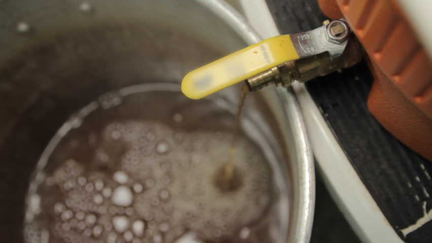 Beer Flowing From Orange Cooler Valve Into Boil Pot - Home Craft Beer Brewing | Shutterstock HD Video #28944796