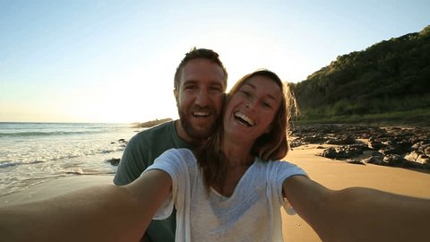 Cheerful young couple on the beach take a selfie portrait at sunrise.
Shot in Australia
People enjoying vacations concept