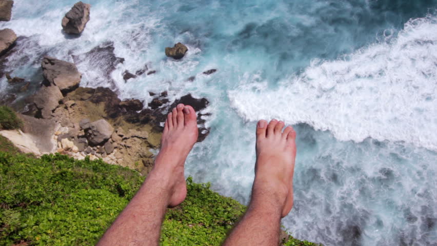 Royalty-free Extremely High POV Cliff Jump into Water above a… #5882156 ...