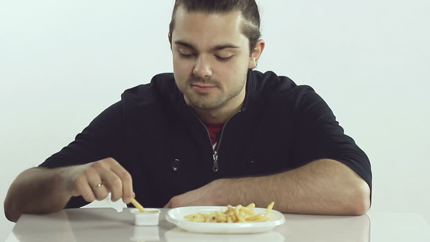 Man eats french fries