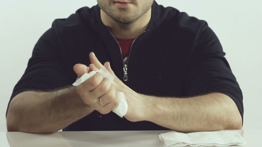 Man using napkin after meal