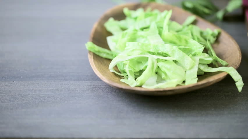 Fresh vegetarian Mexican tostadas on purple cutting board.