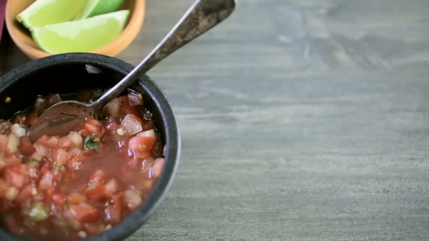 Fresh vegetarian Mexican tostadas on purple cutting board.