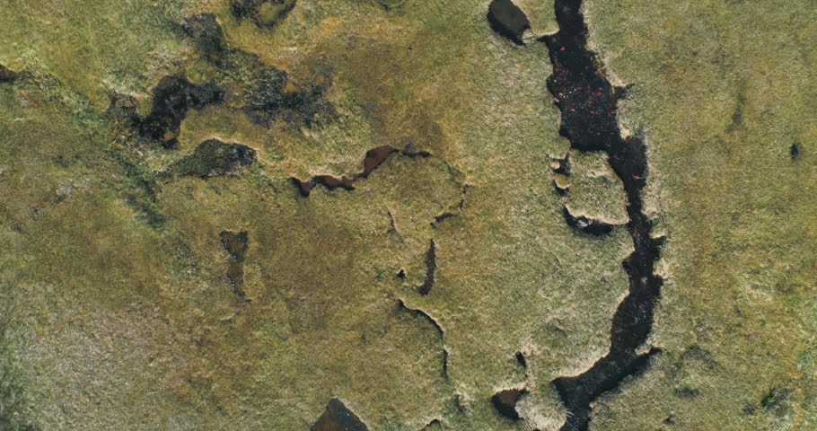 Aerial: flying over grassland, river, trees & mountain near, Chugach Forest, Anchorage, Alaska