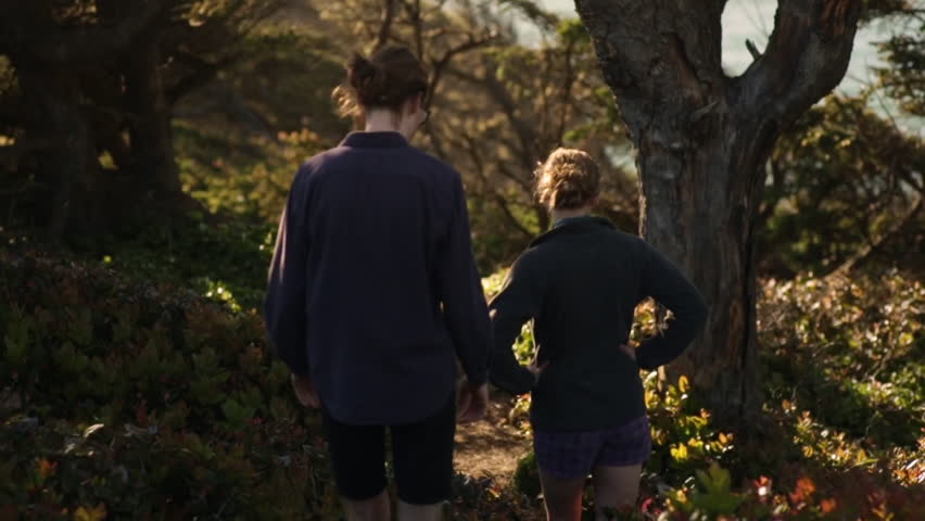 Couple Walk Down Trail (Away From Camera) Toward Pacific Ocean On Oregon Coast, Slow Motion