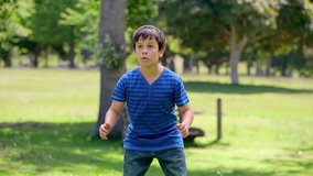 Smiling boy playing rugby in the countryside - Powered by Shutterstock - Get 15% off with code: PIKWIZARD15