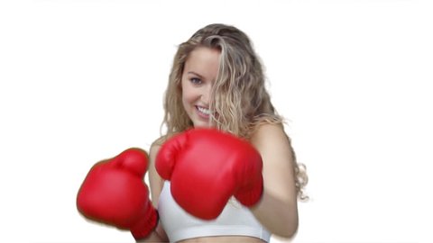 Woman boxing at the camera against a white background
