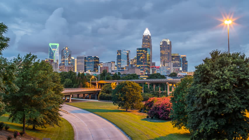 Night time lapse of charlotte skyline with traffic 4k 1080p - time lapse of charlotte north carolina highway at night