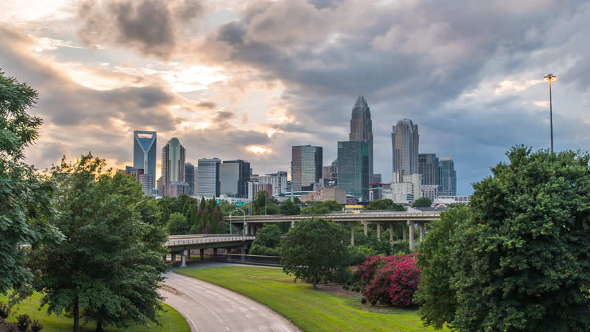 Charlotte sunset time lapse over bridge 4k 1080p - Sun setting behind charlotte north carolina skyline from bridge