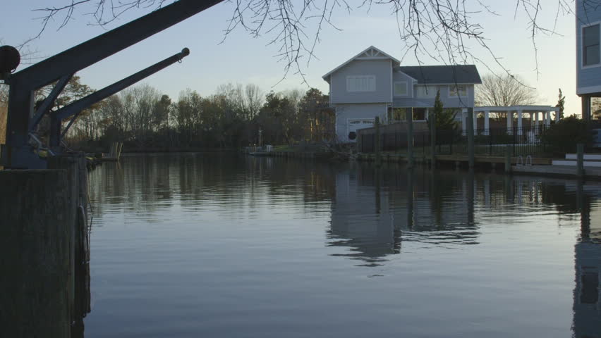 Sunset over Neighborhood with Natural Waterway and Boat Docks