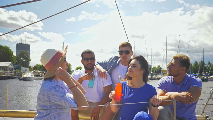 Happy friends resting on a yacht