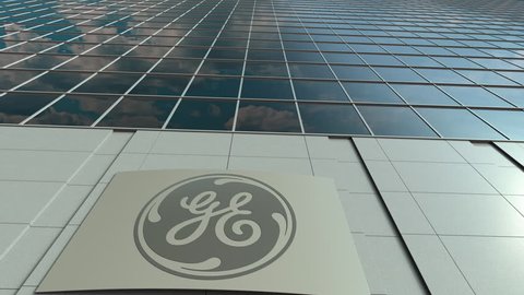 Signage board with General Electric GE logo. Modern office building facade time lapse. Editorial 3D rendering