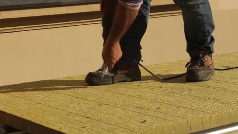 Placing insulation on a roof