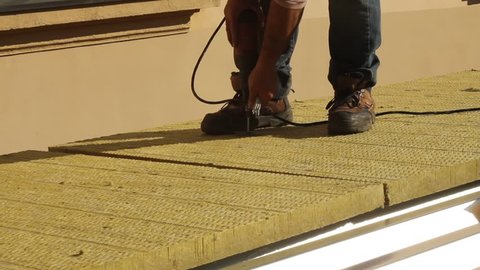 Placing insulation on a roof