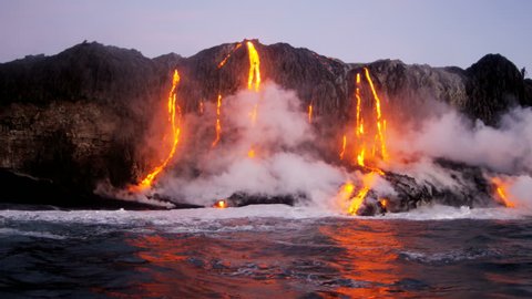 Erupting volcanic red hot lava pouring into the Pacific ocean from Kilauea at dawn Hawaii USA RED EPIC