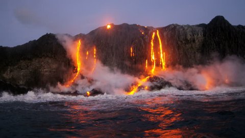 Erupting volcanic red hot lava pouring into the Pacific ocean from Kilauea seen before dawn Hawaii USA RED EPIC