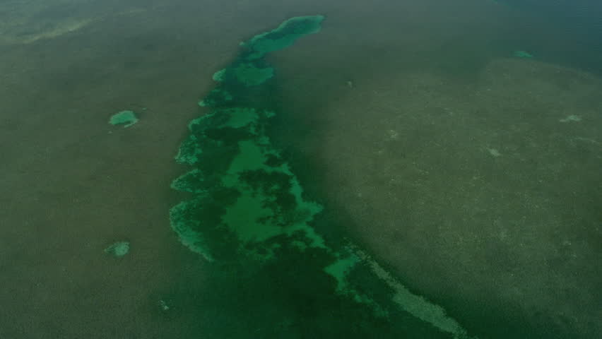 Aerial view small Caribbean tropical Island in turquoise sea Biscayne Bay Southern Florida USA RED EPIC