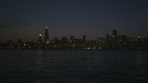 Chicago - April 2017: Illuminated view at sunset of Sears Tower Lake Michigan Chicago city Skyscrapers and skyline Illinois USA RED EPIC