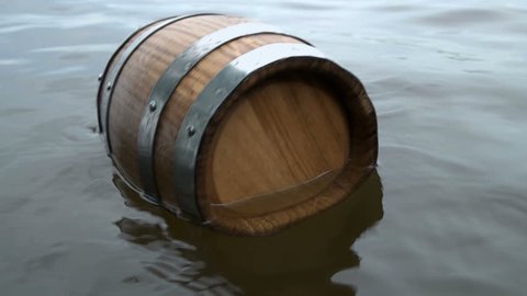 a barrel of wood floating on the waves in the sea