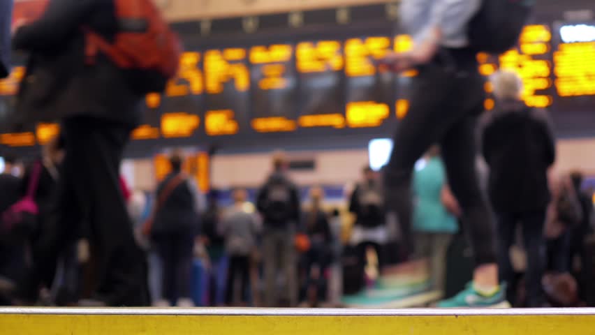 Train station concourse.
Blurred for anonymity. People walking to and fro in front of the departures and arrivals board at a UK railway station. Royalty-Free Stock Footage #29016844