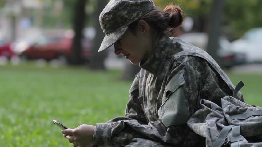 Soldier on her phone