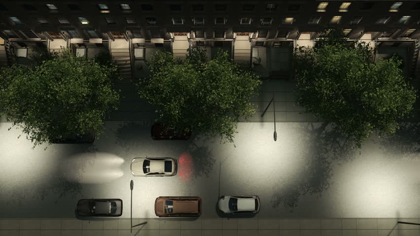 Straight overhead aerial view of night city street lit by streetlights with brownstone apartment buildings, parked and moving cars. Realistic 3D animation rendered in 4K