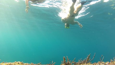 Deep diving

Description: Father and daughter diving
 Stock Video