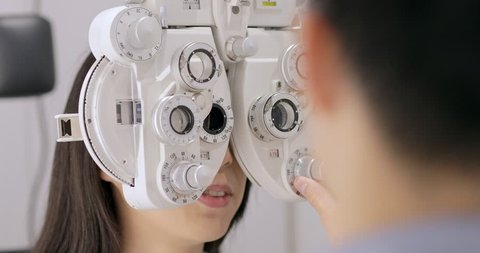 Woman undergo eye exam 