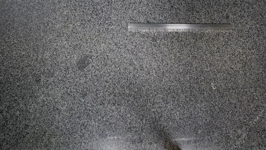 A woman is preparing a table before cooking a caramel.
