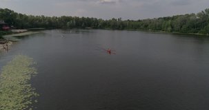 Ukraine. Kiev. July 21, 2017. Truhanov Island. Aerial photography. 4K video. River Dnieper. Trees. Summer. Sunny weather. The sun. Kayaks. Water. Canoe. Sky. Sport. Training. People.