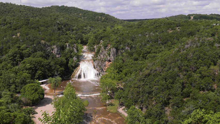 Ultrawide shot of Turner Falls overflowing after days of rain, Arbuckle Mountains, Oklahoma 