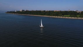 Aerial orbit video sailboat in the bay 4k