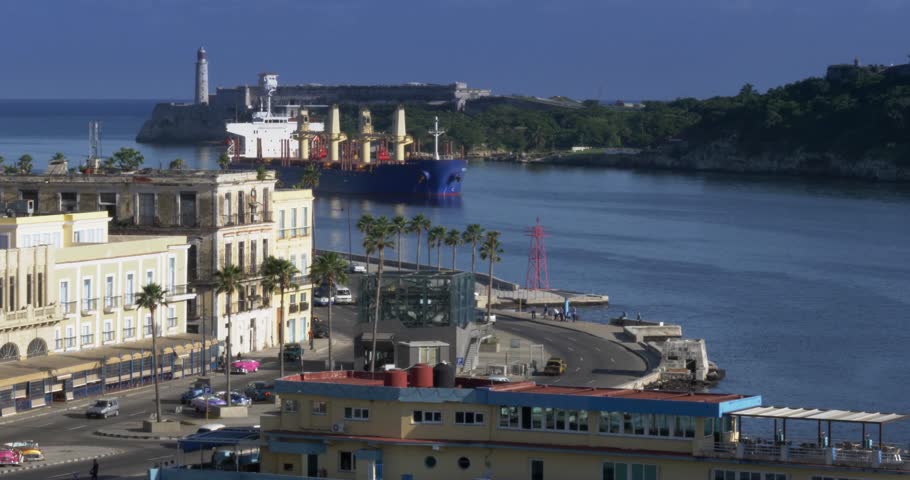 A large freighter cargo ship pulls into Havana Port Bay in Cuba.  	