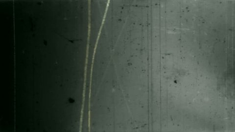 Animated damaged film texture with a grunge look. Loops perfectly. Part computer-generated, part manually scratched 16 mm film.: film stockowy