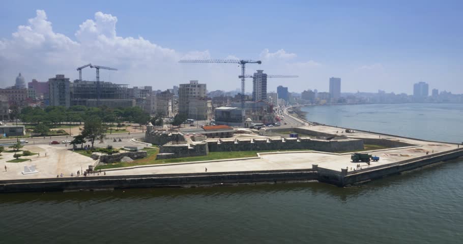 Daytime high angle dolly establishing shot of Castillo de San Salvador de la Punta in Havana, Cuba.  	