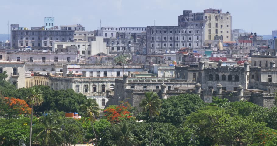 A high angle daytime establishing shot of old buildings near the Havana Port Bay in Cuba.  	