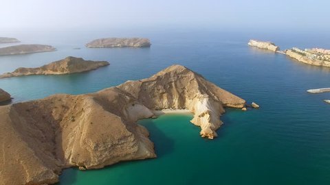 Aerial view of Muscat bay, dive resort, day trip and relaxing area, islands of Indian ocean, beaches and  blue lagoons, Oman, sultanate on Arabian Peninsula, 4k UHD 