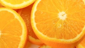 Fresh citrus fruits. Rotate Video footage of the concept of a healthy food and diet. Spinning sliced oranges