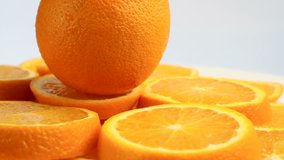 Fresh citrus fruits. Rotate Video footage of the concept of a healthy food and diet. Spinning sliced oranges