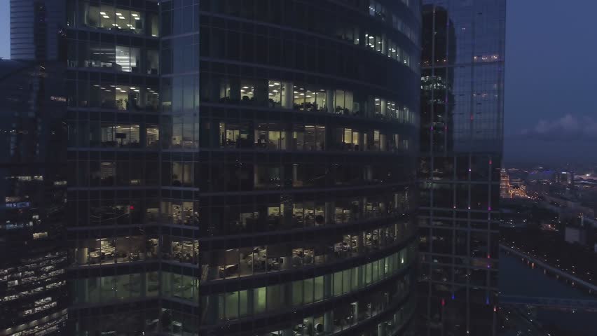A night drone Aerial shot of skyscrapers of  business centre city, 4K Ultra HD real time video. Urban scene of consulting company office. Camera moving around building. Moscow skyline Royalty-Free Stock Footage #29074813