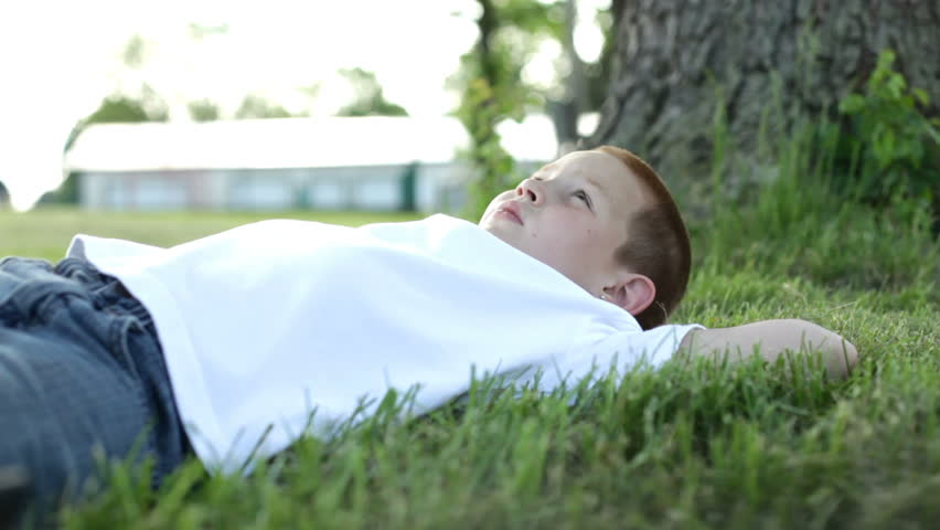 Tired boy HD. Boy Relaxing his Mind.