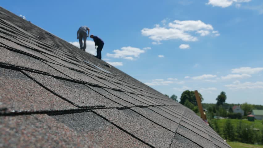 Construction of the roof. Soft roof, shingles. Roofer. Royalty-Free Stock Footage #29081020