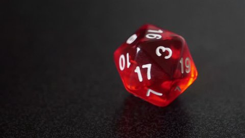 close up slow motion red dice roll, d20 luck concept