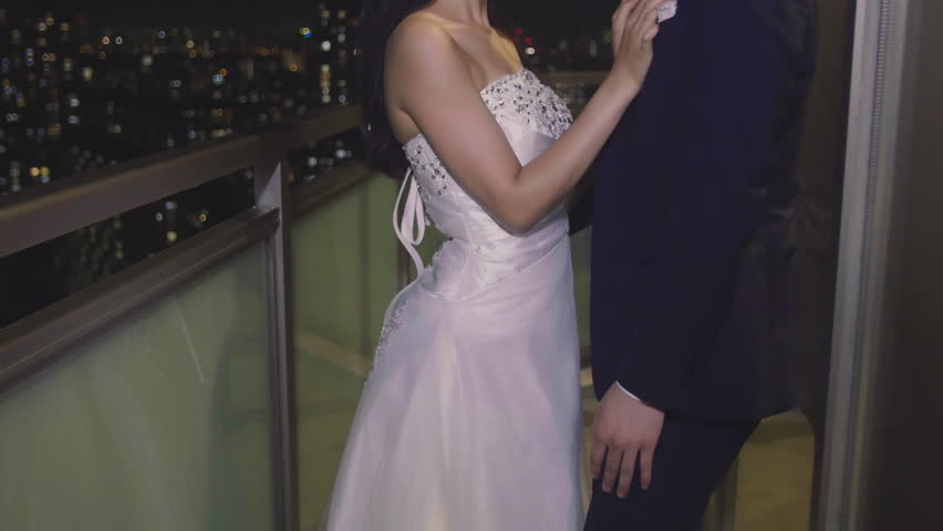 Japanese bride and groom beautiful night scene overlooking city 