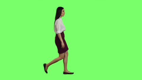 Girl hurries to the negotiations, she does not have time, starts to run. Green screen. Slow motion