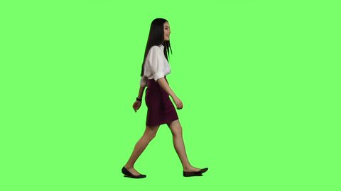 Girl goes to work and waves her hand. Green screen. Side view. Slow motion