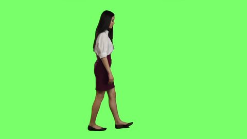 Girl hurries to the negotiations, she does not have time. Green screen. Slow motion