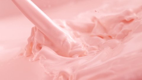 Pouring Strawberry Flavored Milk. Slow Motion.