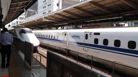 TOKYO, JAPAN - April 19,2017 : A Shinkansen high speed bullet train arrives at the station platform. 