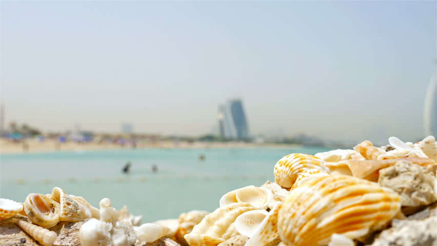 Burj al arab open beach and the iconic Burj al Arab Hotel, most recognizable landmark in Dubai, United Arab Emirates. Middle eastern lifestyle and culture. 4k